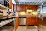 The kitchen is fully equipped with stainless steel appliances and refrigerator, oven, dishwasher and stove.